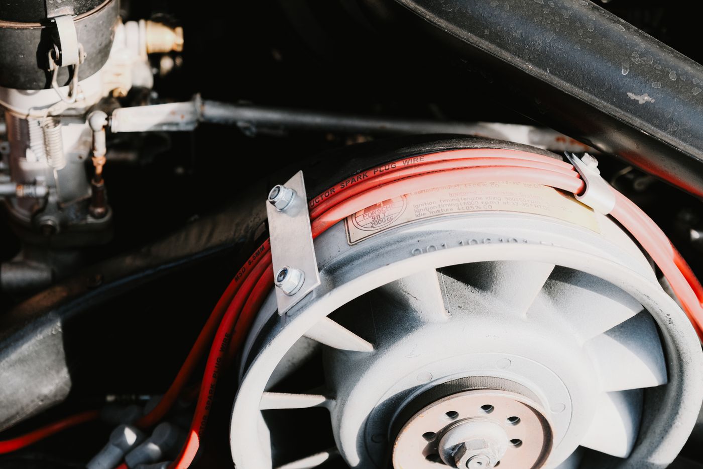 Close-up of car engine wiring and components that rodents can damage