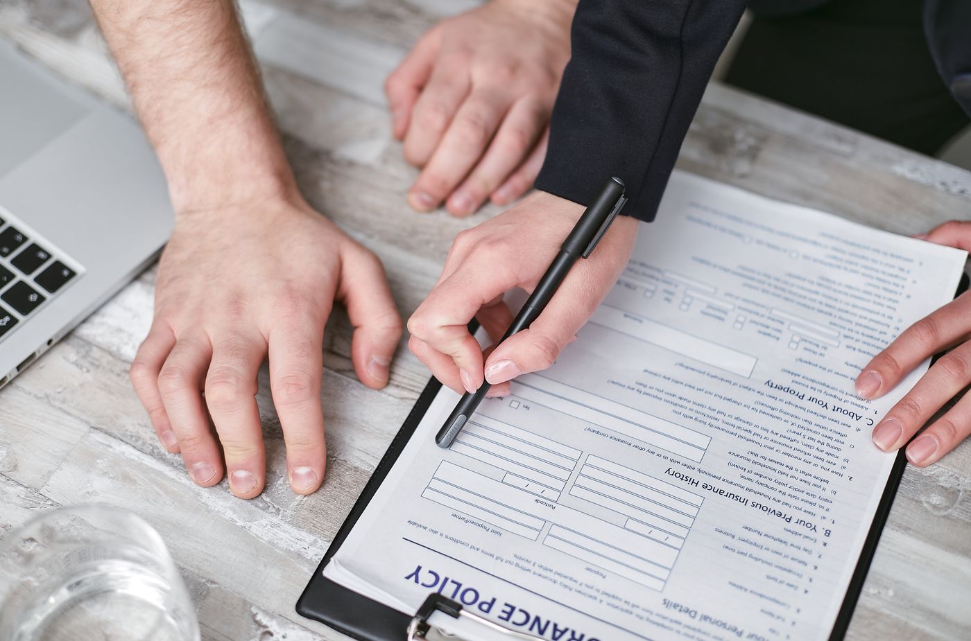 Car insurance claim documents being reviewed during claim assistance